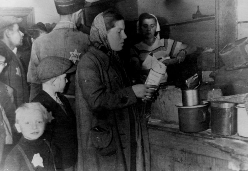 Photographer Mendel Grossman's sister and her son, Yankele, are in the foreground